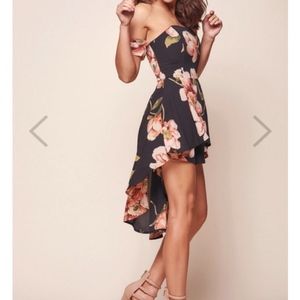 Floral Navy Romper. New with tags. Size medium